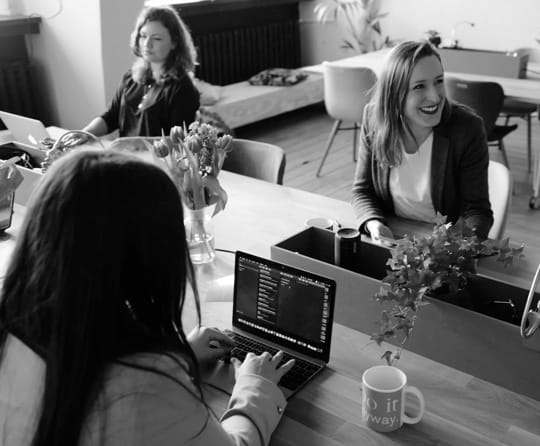 People working in an office setting happily